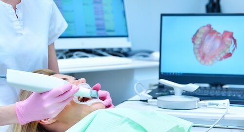 Dentist Looking at Patient's Teeth