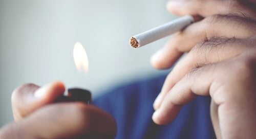 Man Lighting Cigarette