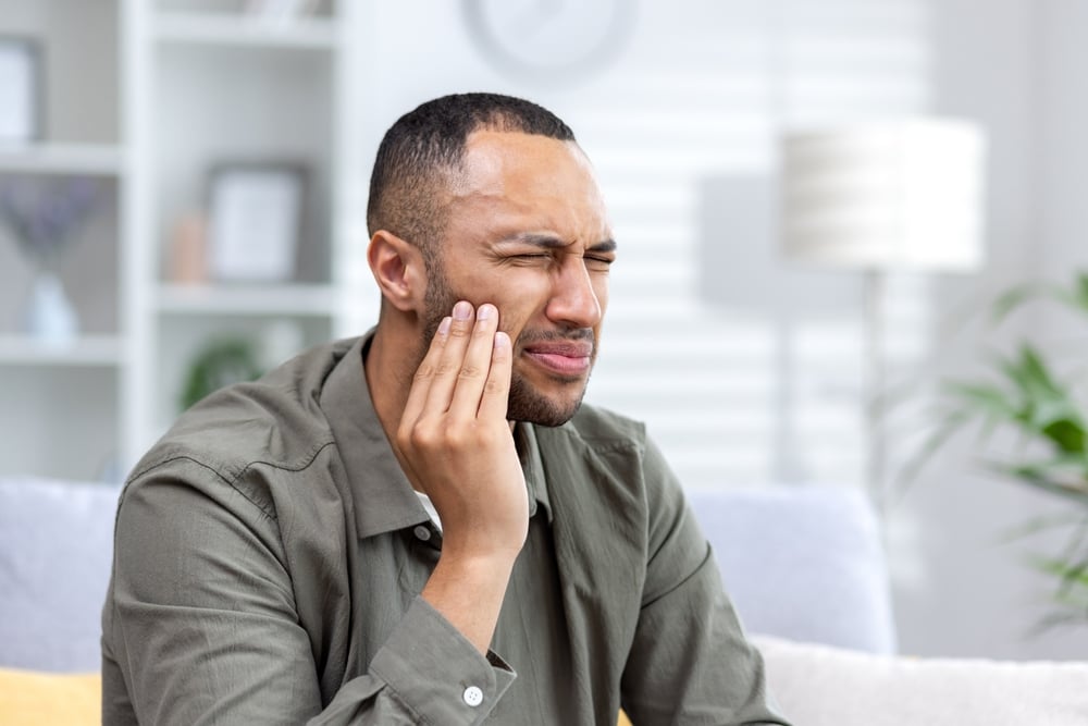 Image of a man needing toothache relief